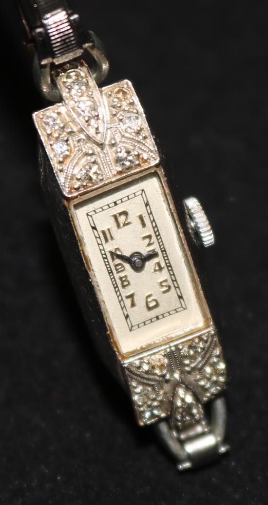 A ladys platinum and diamond set cocktail watch, with steel bracelet.